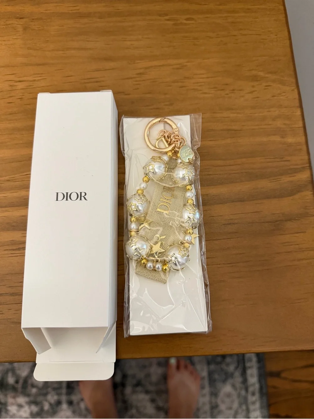 Brand new unopened Dior Gold Tone Key Chain Star Charm White Pearl Beaded
